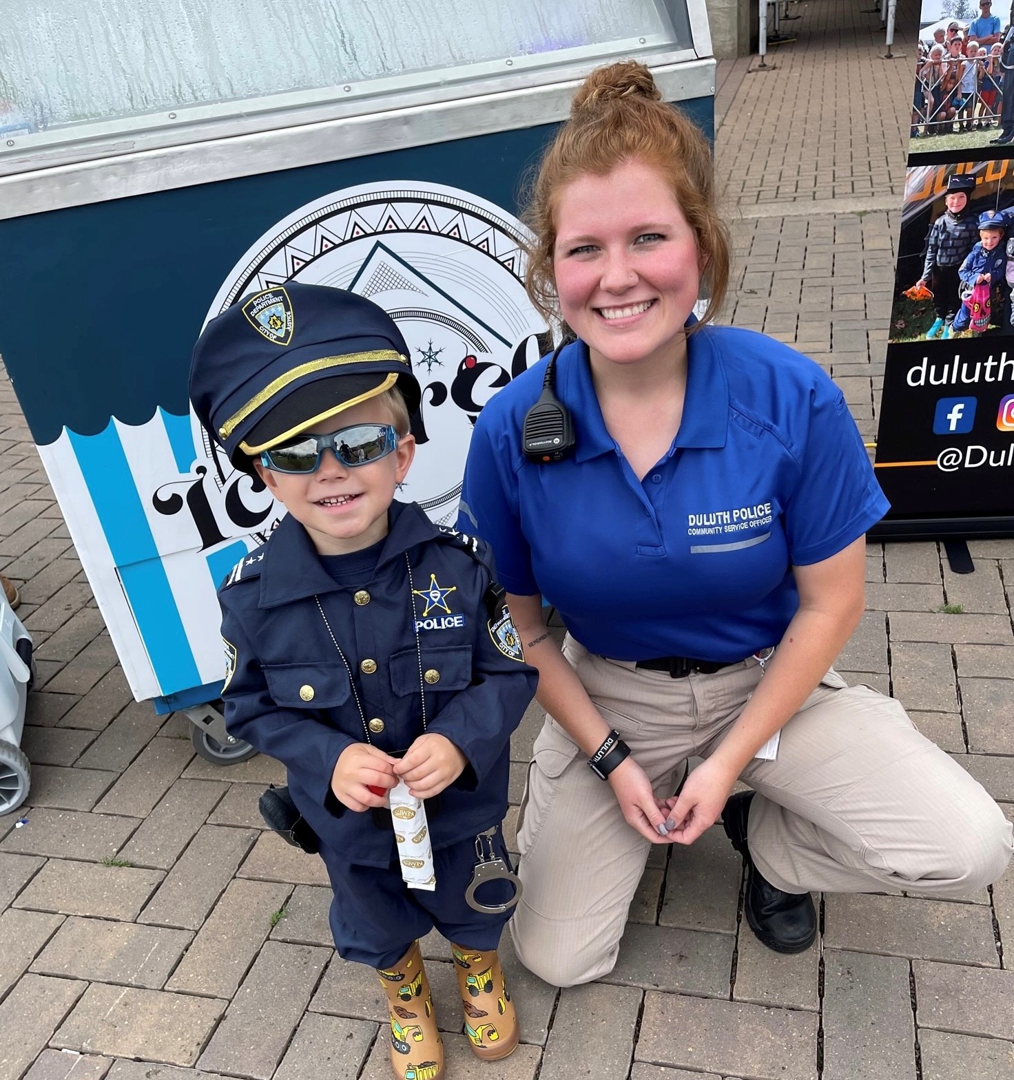 Community Service Officer-Intern Macie Vanburkirk (who is now a sworn police officer) snaps a picture with a 'Junior Officer'.