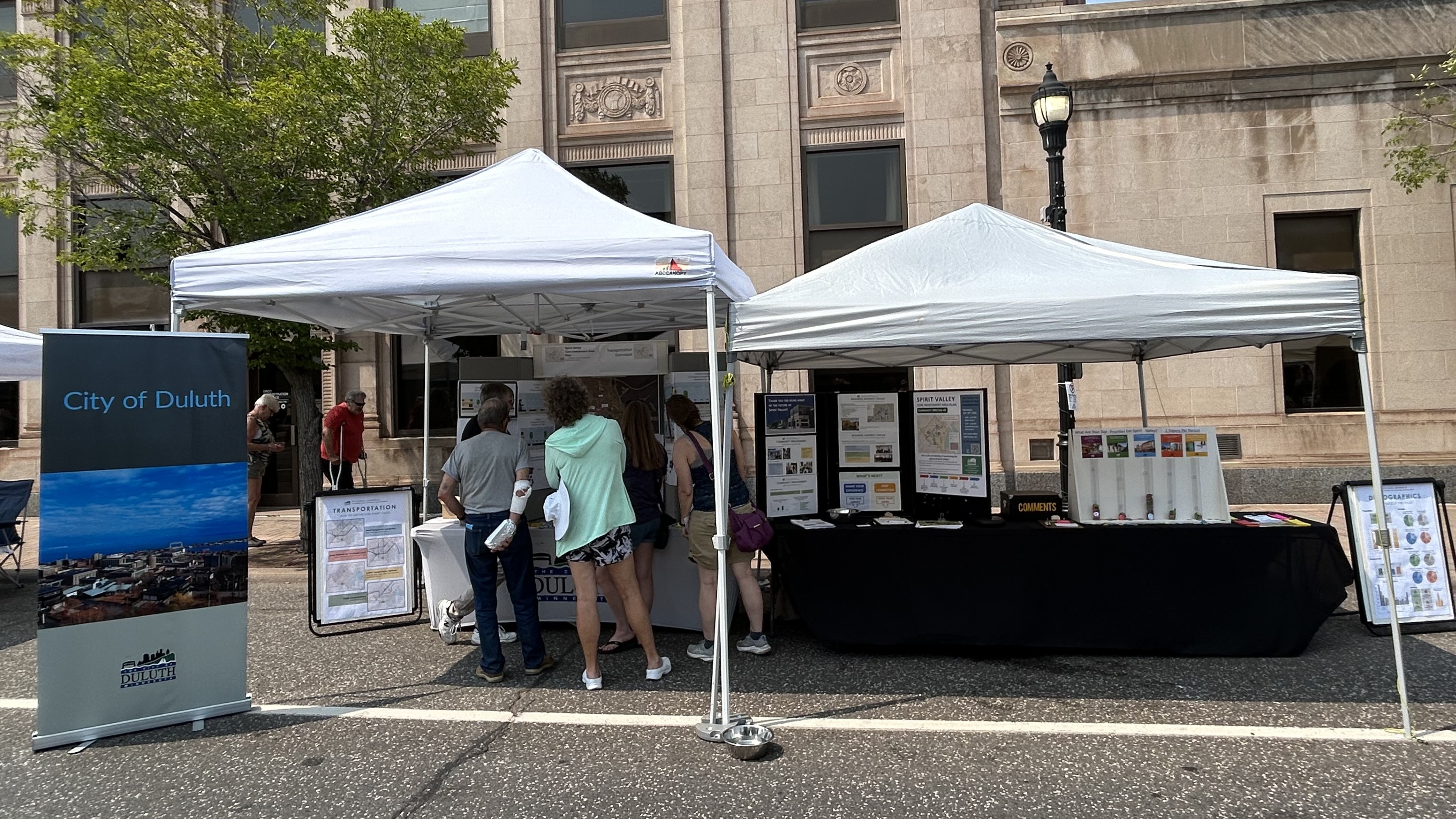 A photo of the City's booth on Grand Ave. during Spirit Valley Days 2025.  The booth provided an opportunity to connect with the public and gain input about the Sprit Valley Plan.