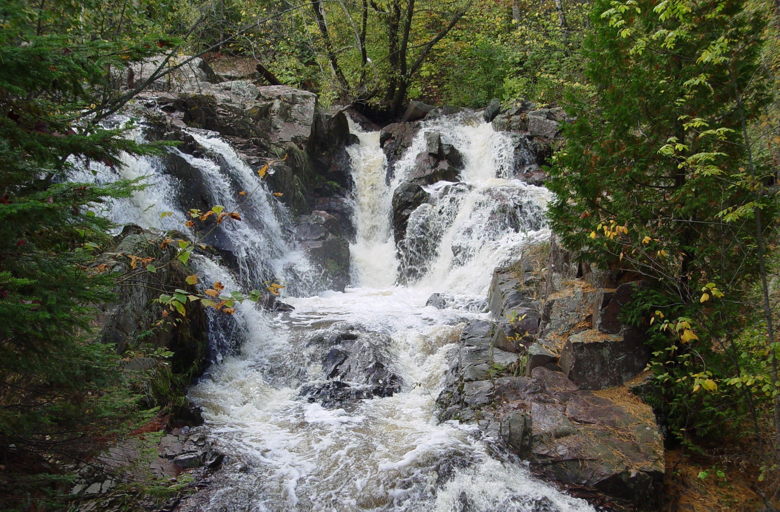 Tischer Creek running with small waterfalls over large exposed bedrock