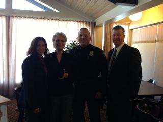 Pictured from Left (Lt. Leigh Wright, Pam Kleinschmidt, Sgt. Chad Nagorski, Officer Mike Erickson