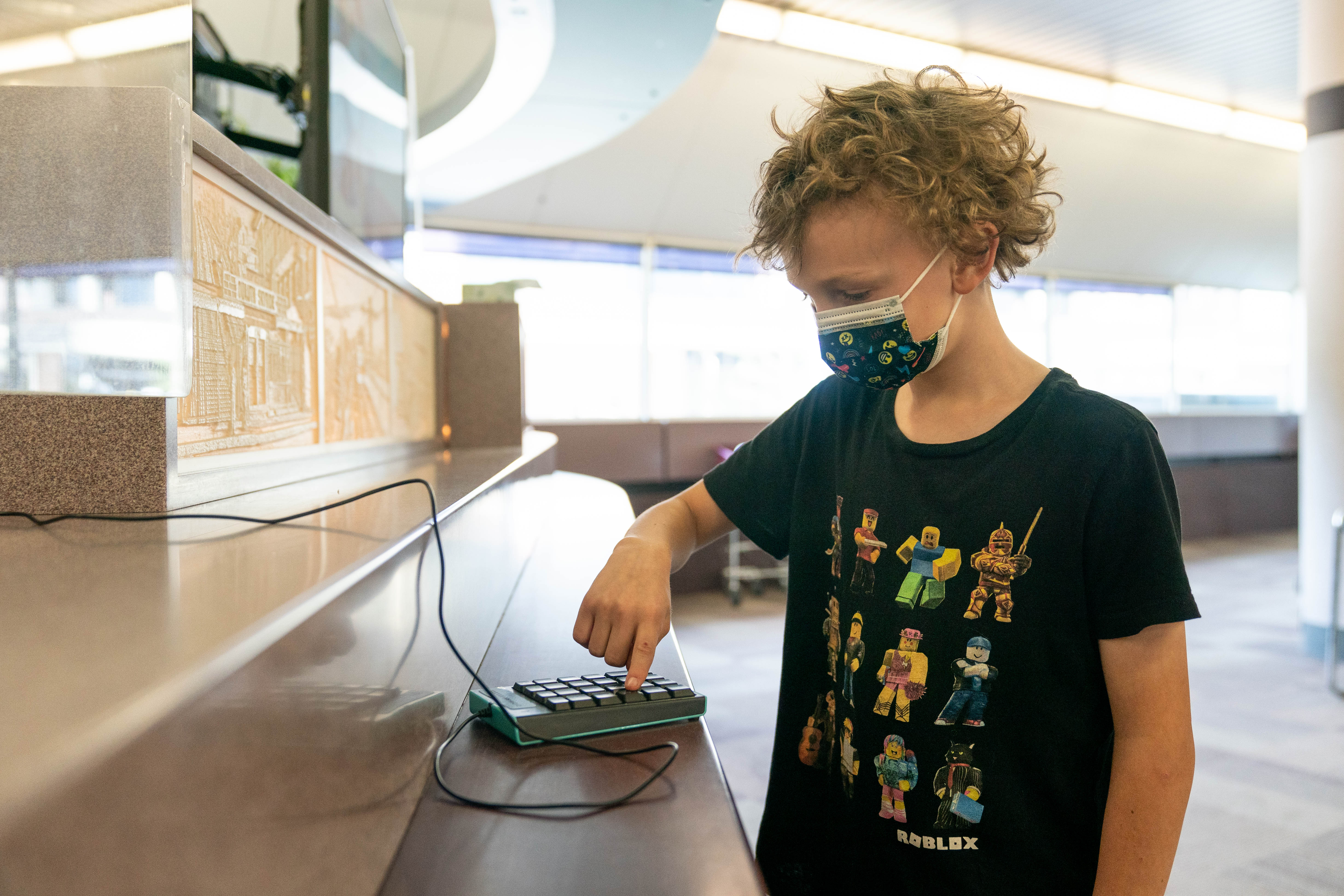 ISD709 3rd grade student Eddie tried typing his student ID number into a pad at the Duluth Public Library.