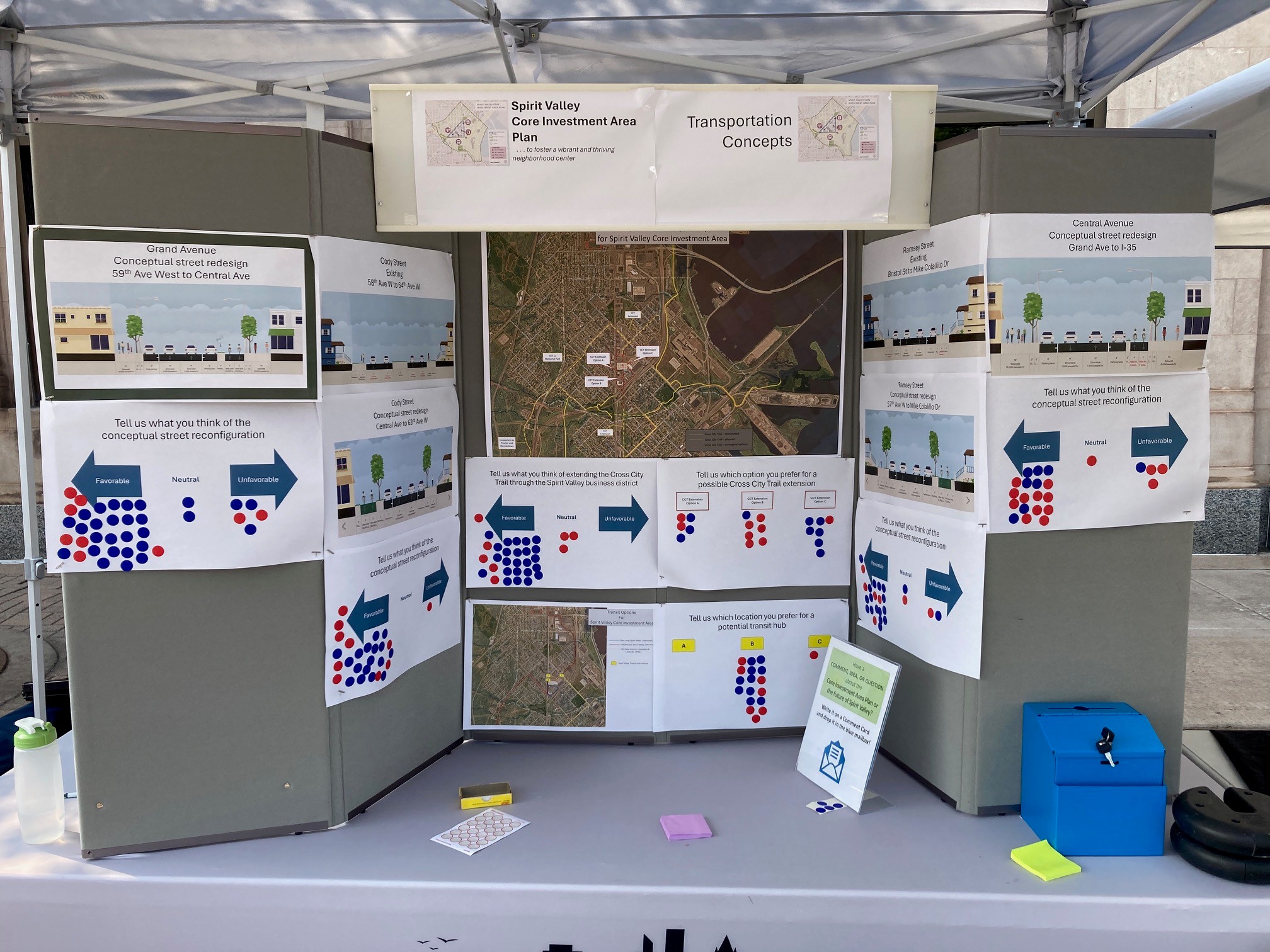 A photo of the Spirit Valley Days 2025 booth display showing maps and possible street layouts where participants could indicate preferences.